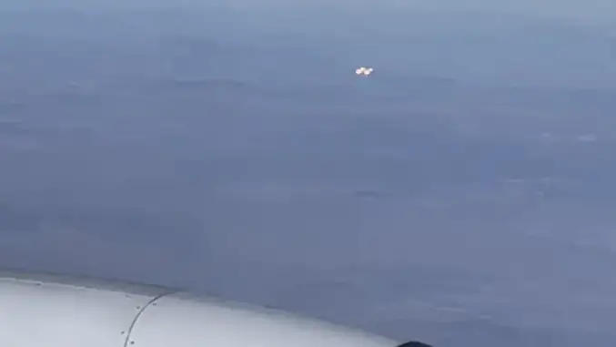 A UFO was sighted by a passenger on a Delta flight flying from Los Angeles to Atlanta at 41,000 feet. The witness captured photos & video, but the exact location & nature of the object remains unknown.