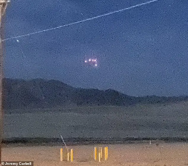 On April 20, 2021, a black, triangular UFO adorned with five red lights was observed floating in the night sky above Camp Wilson, California.